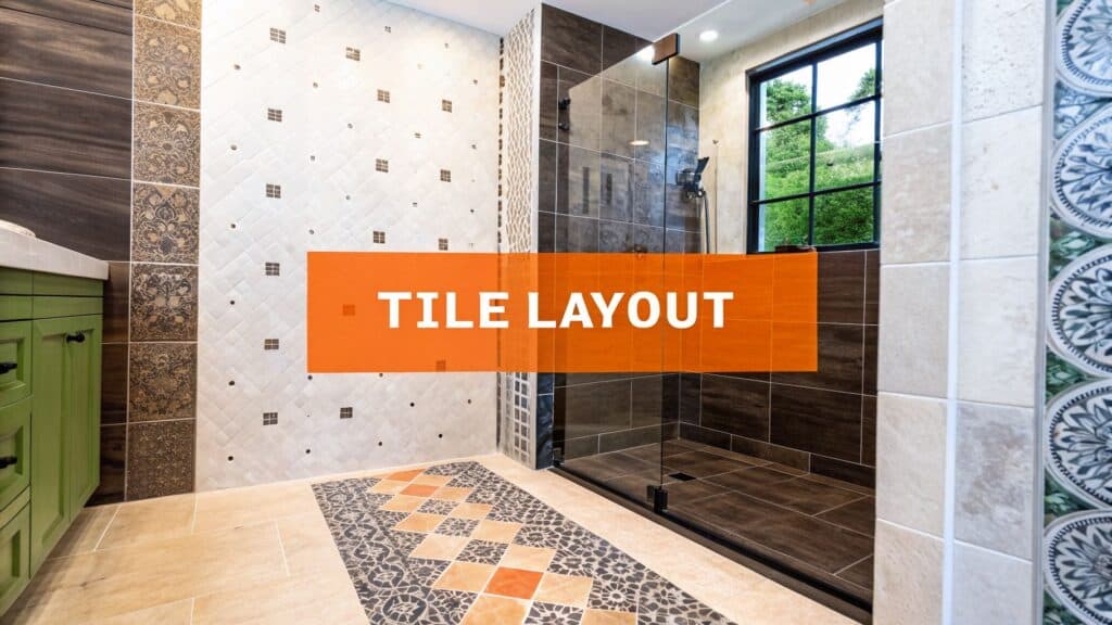 Tile layout in a luxurious shower featuring diverse patterns, including intricate designs on the floor and elegant wall tiles, emphasizing bathroom aesthetics and functionality.